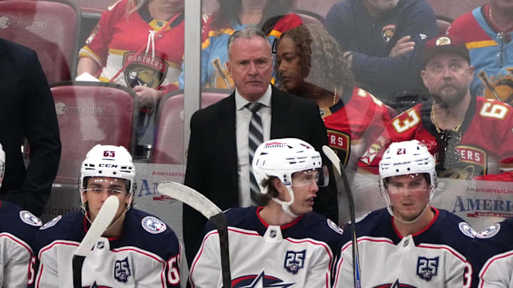 Dec 6, 2025; Sunrise, Florida, USA;  Columbus Blue Jackets head coach Dean Evason keeps an eye on his team during the third period against the Florida Panthers at Amerant Bank Arena. Mandatory Credit: Jim Rassol-Imagn Images