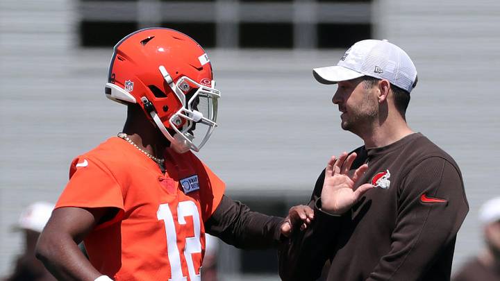Browns quarterback Shedeur Sanders works with offensive coordinator Tommy Rees during rookie minicamp May 9, 2025, in Berea.