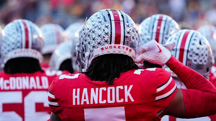 Nov 18, 2023; Columbus, Ohio, USA; Ohio State Buckeyes cornerback Jordan Hancock (7) buckles his chin strap as he takes the field prior to the NCAA football game against the Minnesota Golden Gophers at Ohio Stadium.
