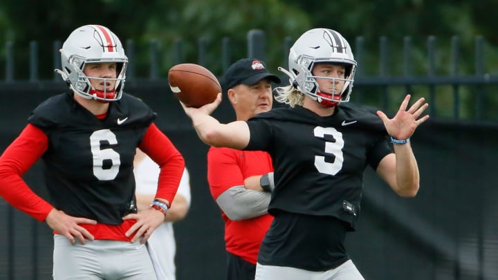 Ohio State Buckeyes quarterback Kyle McCord (6) watches as Quinn Ewers (3) throws during football training camp at the Woody Hayes Athletic Center in Columbus on Wednesday, Aug. 18, 2021.

Ohio State Football Training Camp