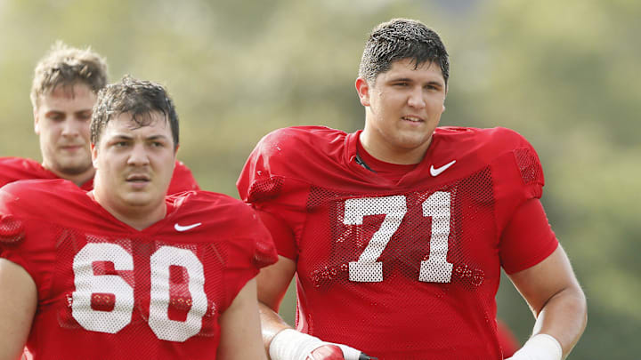 Ohio State Buckeyes offensive lineman Ben Christman (71) runs beside Ryan Smith (60) during football training camp at the Woody Hayes Athletic Center in Columbus on Tuesday, Aug. 10, 2021.