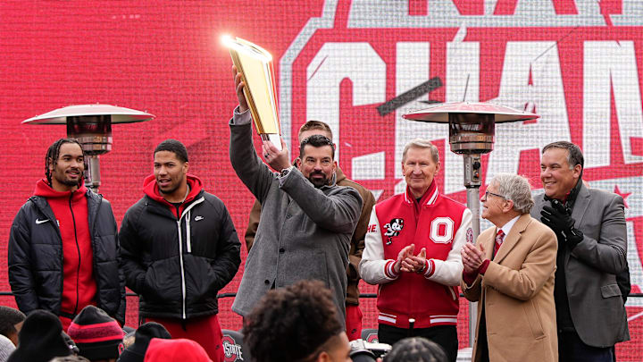 Ohio State Buckeyes head coach Ryan Day hoists the championship trophy during the Ohio State Buckeyes College Football Playoff National Championship celebration at Ohio Stadium in Columbus on Jan. 26, 2025.