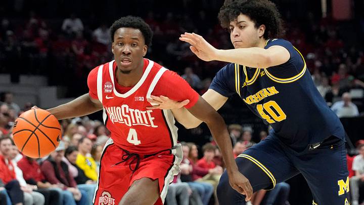 Mar 3, 2024; Columbus, OH, USA; Ohio State Buckeyes guard Dale Bonner (4) dribbles around Michigan Wolverines guard George Washington III (40) during their NCAA Division I Mens basketball game at Value City Arena.