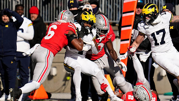 Ohio State Buckeyes safety Sonny Styles (6) tackles Michigan Wolverines running back Donovan Edwards (7) during the first half of the NCAA football game at Ohio Stadium in Columbus on Saturday, Nov. 30, 2024.