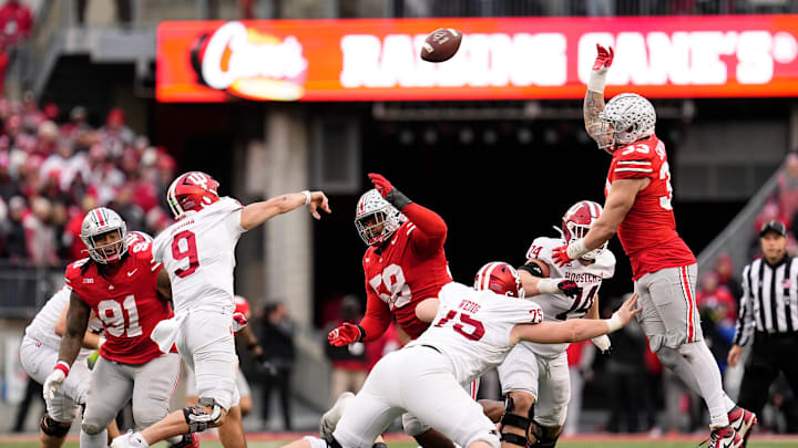 Ohio State Buckeyes defensive tackle Ty Hamilton (58) and defensive end Jack Sawyer (33) defend a pass by Indiana Hoosiers quarterback Kurtis Rourke (9) during the second half of the NCAA football game at Ohio Stadium in Columbus on Saturday, Nov. 23, 2024. Ohio State won 38-15.