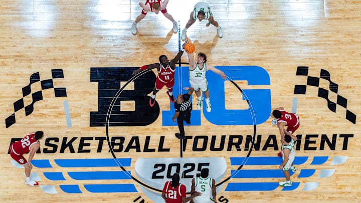 Indiana Hoosiers center Oumar Ballo (11) and Oregon Ducks center Nate Bittle (32) tip off Thursday, March 13, 2025, during the 2025 TIAA Big Ten Men’s Basketball Tournament at Gainbridge Fieldhouse in Indianapolis.