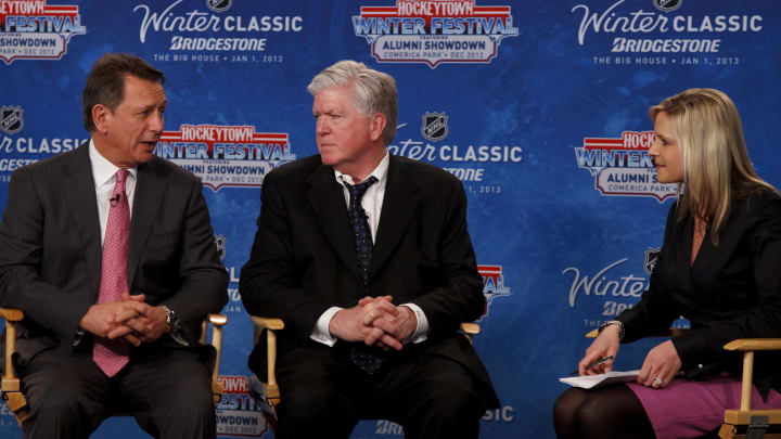 Feb. 9, 2012; Detroit, MI, USA; General managers Ken Holland (left) of the Detroit Red Wings and Brian Burke (center) of the Toronto Maple Leafs talk with NHL Networks sportscaster Kathryn Tappen (right) during an NHL press conference for the 2013 Winter Classic at Comerica Park. Mandatory Credit: Rick Osentoski-USA TODAY Sports