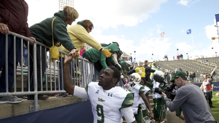 Oct 17, 2015; East Hartford, CT, USA; South Florida Bulls fans congratulate quarterback Quinton Flowers (9) and his teammates after defeating the Connecticut Huskies at Rentschler Field. USF defeated UConn 28-20. Mandatory Credit: David Butler II-USA TODAY Sports