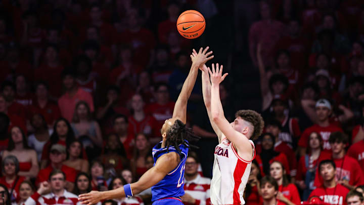 Feb 28, 2026; Tucson, Arizona, USA; Arizona Wildcats guard Anthony Dell’Orso (3) makes a jumper over Kansas Jayhawks guard Darryn Peterson (22) during the first half of the game at McKale Memorial Center. Mandatory Credit: Aryanna Frank-Imagn Images