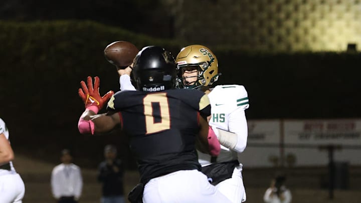 Oaks Christian's Hayden Lowe puts the pressure on St. Bonaventure quarterback Jaxson Carper during the third quarter of Oaks Christian's 35-0 Marmonte League win over visiting St. Bonaventure at Redell Field.