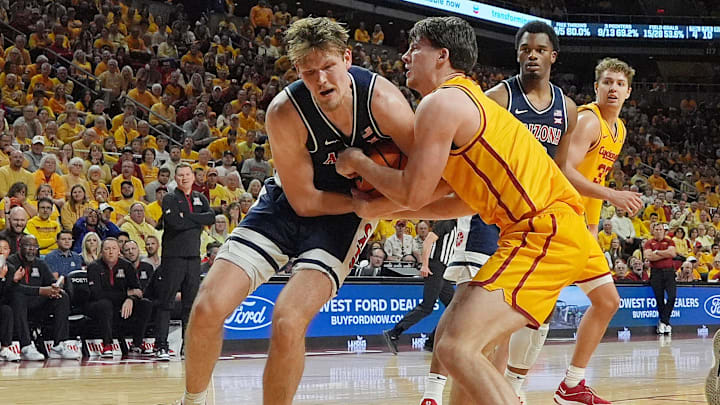 Iowa State Cyclones guard Nate Heise (0) and Arizona Wildcats forward Henri Veesaar (13) battle for loose ball during the first half in the Big-12 men’s basketball showdown at Hilton Coliseum on Saturday March 1, 2025 in Ames, Iowa.