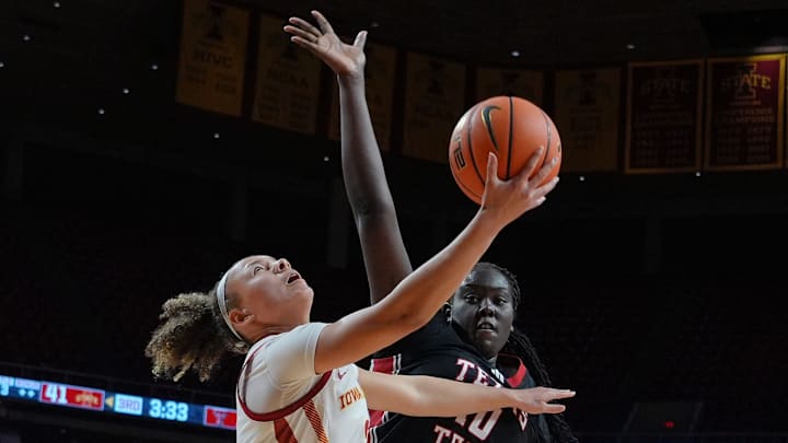Iowa State Cyclones' guard Arianna Jackson (2) goes for a layup around Texas Tech Lady Raiders center Achol Magot (10) during the third quarter in the Big-12 women’s basketball showdown at Hilton Coliseum on Sunday, Jan. 14, 2025, in Ames, Iowa.