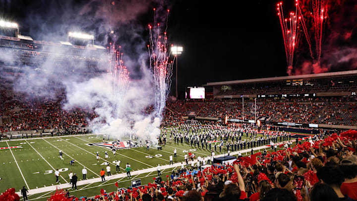 Aug 30, 2025; Tucson, Arizona, USA; Arizona Wildcats team runs out before the start of the Hawaii Rainbow Warriors at Arizona Stadium. Mandatory Credit: Aryanna Frank-Imagn Images