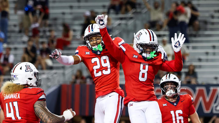 Sep 6, 2025; Tucson, Arizona, USA; Arizona Wildcats defensive back Jay’Vion Cole (8) celebrates a touchdown with defensive back Devin Dunn (29) during the third quarter of the game against the Weber State Wildcats at Arizona Stadium. Mandatory Credit: Aryanna Frank-Imagn Images