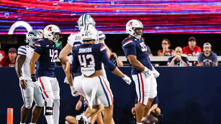 Sep 12, 2025; Tucson, Arizona, USA; Arizona Wildcats defensive lineman Leroy Palu (95) celebrates a tackle against the Kansas State Wildcats during the third quarter of the game at Arizona Stadium. Mandatory Credit: Aryanna Frank-Imagn Images