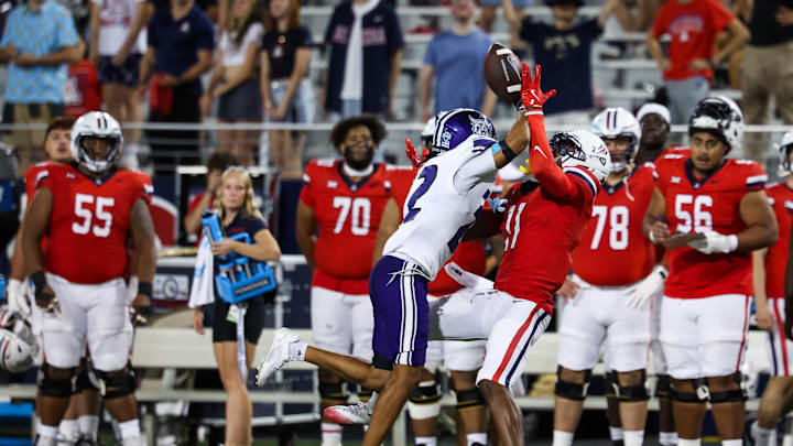Sep 6, 2025; Tucson, Arizona, USA; Weber State Wildcats center back Ishaan Daniels (22) interferes with a pass intended for wide receiver Chris Hunter (11) during the third quarter of the game at Arizona Stadium. Mandatory Credit: Aryanna Frank-Imagn Images