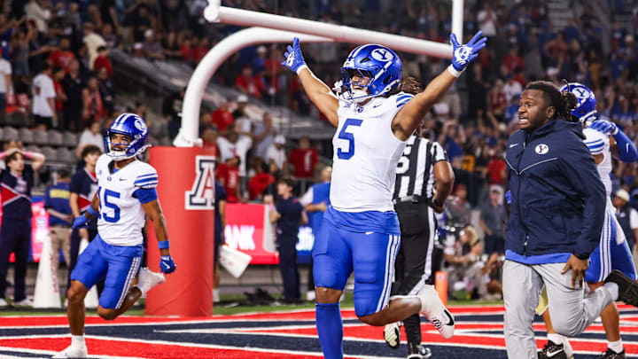 Oct 11, 2025; Tucson, Arizona, USA; Brigham Young Cougars wide receiver Cody Hagen (5) runs onto the field after the Brigham Young Cougars secure the win against the Arizona Wildcats after overtime at Arizona Stadium.  Mandatory Credit: Aryanna Frank-Imagn Images