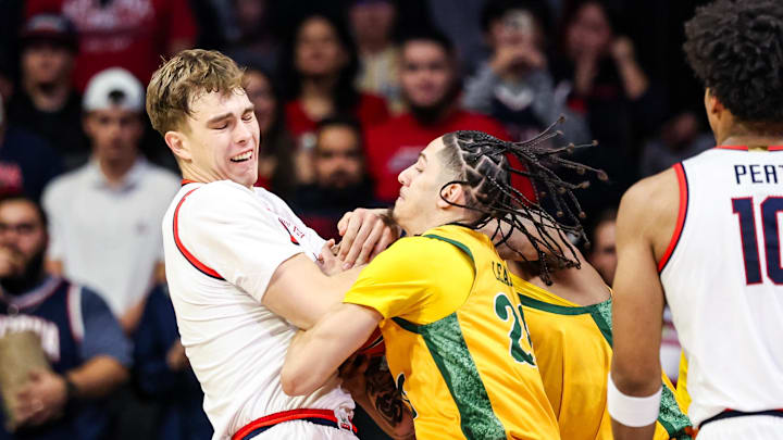 Nov 29, 2025; Tucson, Arizona, USA; Norfolk State Spartans guard Jordan Leaks (20) attempts to steal the ball from Arizona Wildcats center Motiejus Krivas (13) during the first half at McKale Memorial Center. Mandatory Credit: Aryanna Frank-Imagn Images