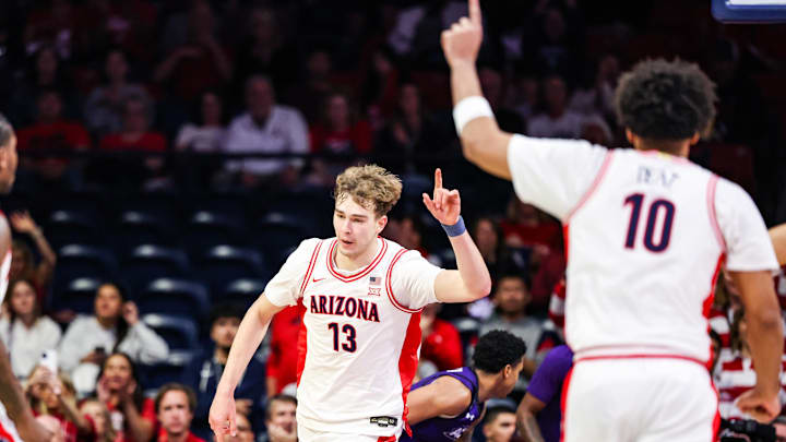 Dec 16, 2025; Tucson, Arizona, USA; Arizona Wildcats center Motiejus Krivas (13) gestures after he dunks the ball against the Abilene Christian Wildcats during the first half of the game at McKale Memorial Center. Mandatory Credit: Aryanna Frank-Imagn Images