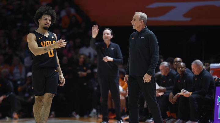 Feb 14, 2026; Knoxville, Tennessee, USA;  Tennessee Volunteers head coach Rick Barnes speaks with guard Ja'kobi Gillespie (0) during the first half against the Louisiana State Tigers at Thompson-Boling Arena at Food City Center. Mandatory Credit: Randy Sartin-Imagn Images