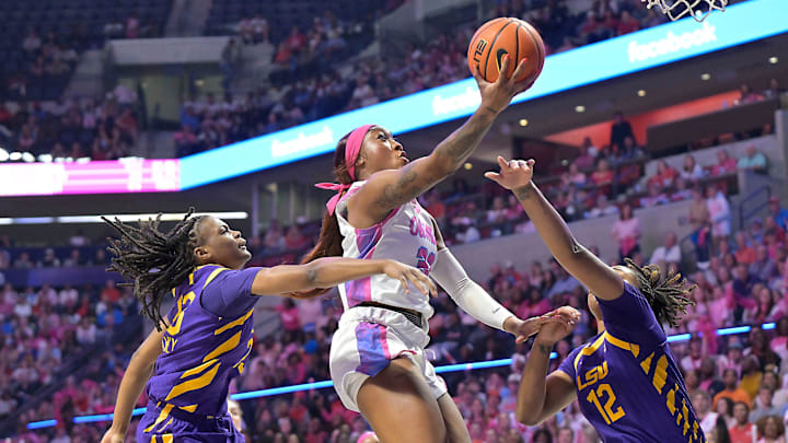Ole Miss forward Cotie McMahon (32) scores between LSU's MiLaysia Fulwiley (23) and LSU's Mikaylah Williams (12) in a NCAA women’s college basketball game at the Sandy and John Black Pavilion at Ole Miss in Oxford, Miss. on Thursday, Feb. 19, 2026.