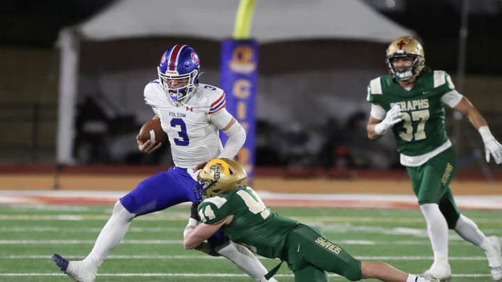 St. Bonaventure's Dylan Dunst tackles Folsom quarterback Ryder Lyons during the fourth quarter of the CIF-State Division 1-A state championship bowl at Saddleback College in Mission Viejo on Saturday, Dec. 9, 2023. St. Bonaventure lost 20-14.