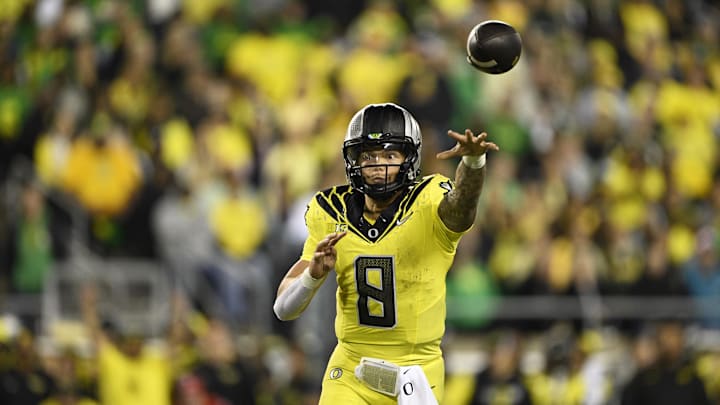 Oct 4, 2024; Eugene, Oregon, USA; Oregon Ducks quarterback Dillon Gabriel (8) throws a touchdown pass during the second half against the Michigan State Spartans at Autzen Stadium. Mandatory Credit: Troy Wayrynen-Imagn Images