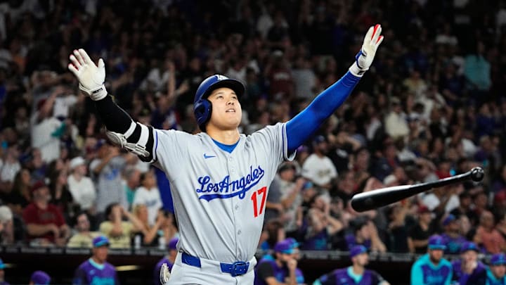 Los Angeles Dodgers designated hitter Shohei Ohtani tosses his bat after hitting a three-run home run against the Arizona Diamondbacks in the ninth inning at Chase Field in Phoenix on May 9, 2025. 