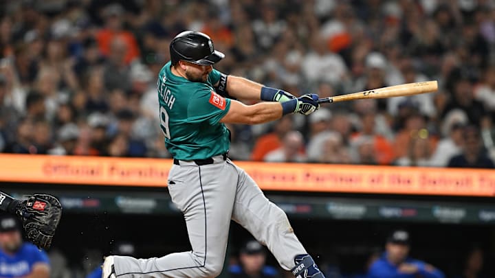 Jul 11, 2025; Detroit, Michigan, USA;  Seattle Mariners designated hitter Cal Raleigh (29) hits a grand slam home run against the Detroit Tigers in the ninth inning at Comerica Park. Mandatory Credit: Lon Horwedel-Imagn Images