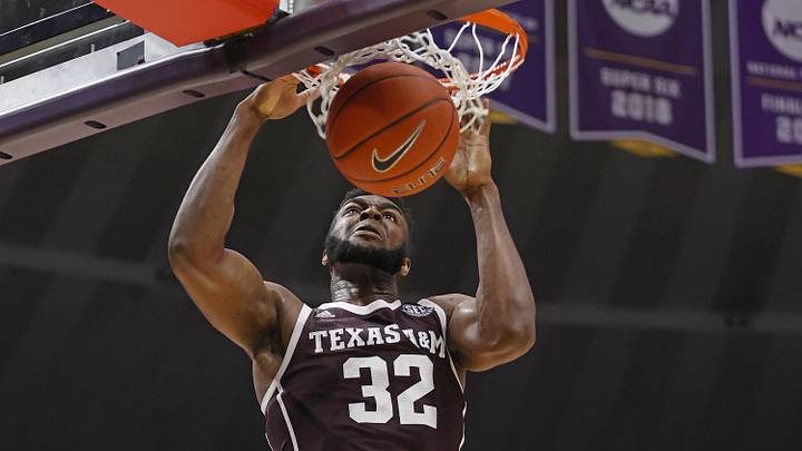 Feb 29, 2020; Baton Rouge, Louisiana, USA;  Texas A&M Aggies forward Josh Nebo (32) dunks the ball against LSU Tigers during the second half at Maravich Assembly Center. Mandatory Credit: Stephen Lew-USA TODAY Sports