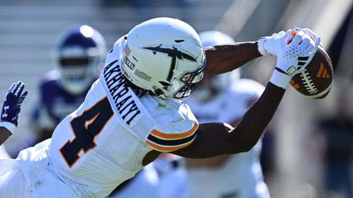 Sep 9, 2023; Evanston, Illinois, USA;  University of Texas El Paso Miners wide receiver Kelly Akharaiyi (4) stretches out to make a catch for a first down in the first half against the Northwestern Wildcats at Ryan Field. Mandatory Credit: Jamie Sabau-USA TODAY Sports