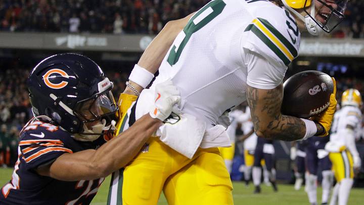 Green Bay Packers wide receiver Christian Watson (9) crosses the goal line on a first quarter pass reception against Chicago Bears cornerback Nick McCloud (24) during their wild-card playoff football game Saturday, January 10, 2026, at Soldier Field in Chicago, Illinois. 
Wm. Glasheen /USA TODAY NETWORK-Wisconsin.