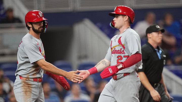 Aug 19, 2025; Miami, Florida, USA;  St. Louis Cardinals second baseman Thomas Saggese (25) congratulates center fielder Nathan Church (27) on scoring a run in the second inning against the Miami Marlins at loanDepot Park. Mandatory Credit: Jim Rassol-Imagn Images