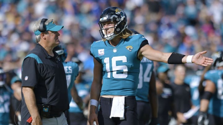 Jacksonville Jaguars head coach Doug Pederson talks with quarterback Trevor Lawrence.