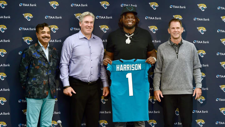 Jacksonville Jaguars owner Shad Khan, head coach Doug Pederson, and first-round draft pick Anton Harrison.