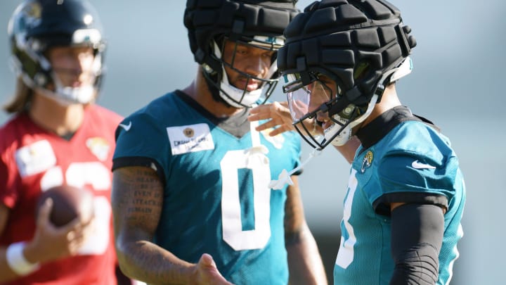 Jacksonville Jaguars wide receiver Gabe Davis (0) greets wide receiver Christian Kirk (13) on the field during the fifth day of the NFL football training camp practice session Monday, July 29, 2024 at EverBank Stadium's Miller Electric Center in Jacksonville, Fla..