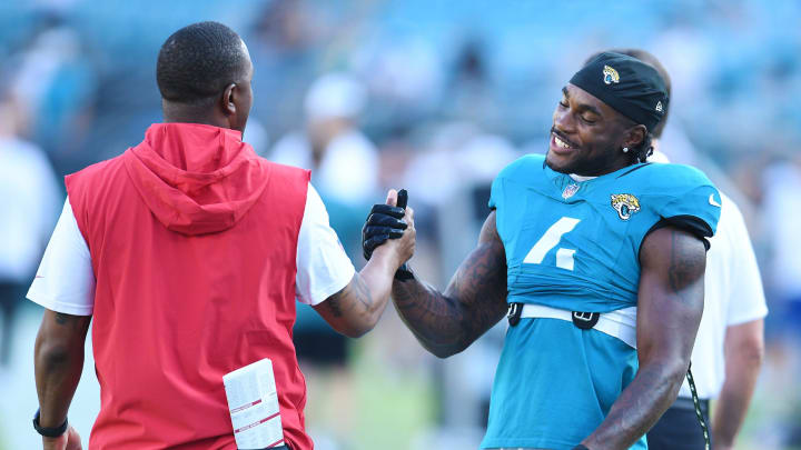 Jacksonville Jaguars running back Tank Bigsby (4) greets a member of the Tampa Bay Buccaneers staff during pregame warmups. The Jacksonville Jaguars hosted the Tampa Bay Buccaneers at EverBank Stadium for the Jaguars second preseason game of the season Saturday, August 17, 2024. 