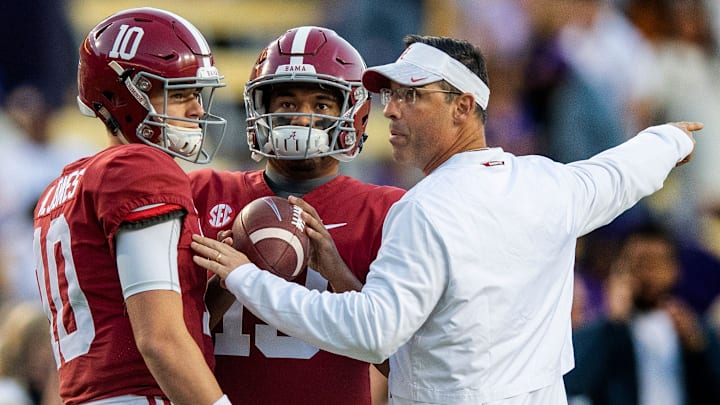 Alabama quarterback Tua Tagovailoa (13), quarterback Mac Jones (10) and quarterbacks coach Dan Enos before the LSU game at Tiger Stadium in Baton Rouge, La., on Saturday November 3, 2018