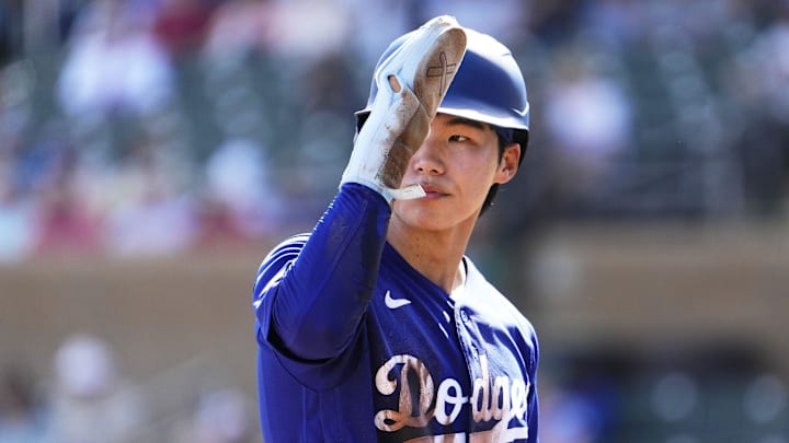 Los Angeles Dodgers second baseman Hyeseong Kim (6) reacts after reaching third base against the Arizona Diamondbacks in the first inning on Feb. 25, 2026, at Salt River Fields in Scottsdale.