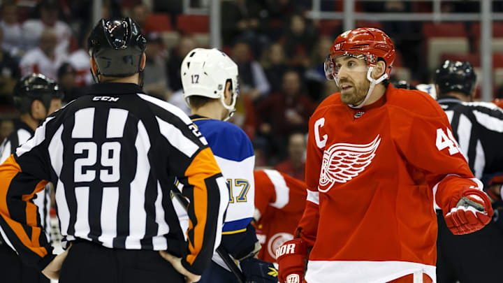 February 1, 2013; Detroit, MI, USA; Detroit Red Wings center Henrik Zetterberg (40) talks to referee Ian Walsh (29) in the first period against the St. Louis Blues at Joe Louis Arena. Mandatory Credit: Rick Osentoski-Imagn Images