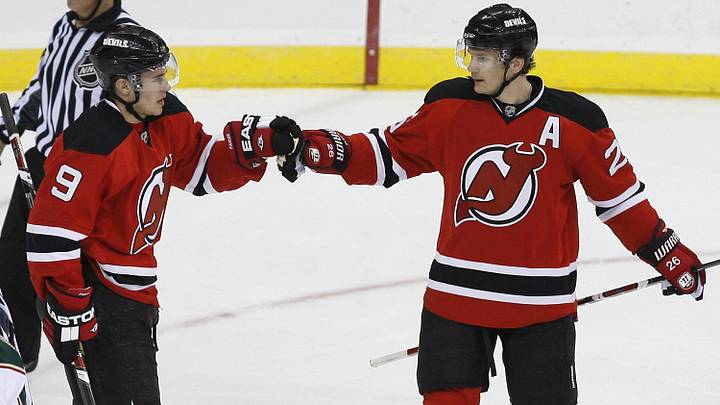 Mar 20, 2009; Newark, NJ, USA; New Jersey Devils left wing Zach Parise (9) congratulates New Jersey Devils left wing Patrik Elias (26) on his goal during the third period at the Prudential Center.  The Devils defeated the Wild 4-0.  Mandatory Credit: Ed Mulholland-Imagn Images