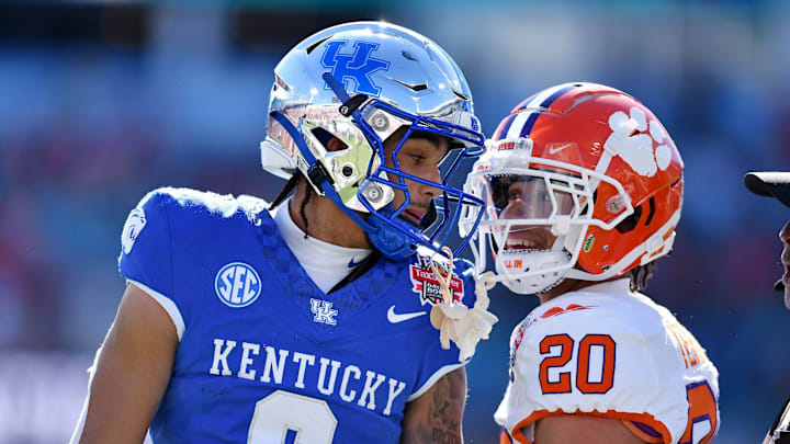 Kentucky Wildcats wide receiver Dane Key (6) carries Clemson Tigers cornerback Avieon Terrell (20) exchange words after Key took a long pass to the 5-yard line while being defended by Terrell during the first quarter. The Kentucky Wildcats faced off against the Clemson Tigers Friday, December 29, 2023, in the TaxSlayer Gator Bowl in Jacksonville, Florida. The Wildcats led 14 to 10 at the half. [Bob Self/Florida Times-Union]