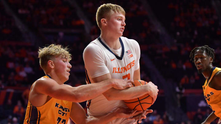 Nov 11, 2022; Champaign, Illinois, USA; UMKC Kangaroos guard Kevin Sullivan (33) tries to pull the ball from Illinois Fighting Illini forward Connor Serven (2) during the second half at State Farm Center. Mandatory Credit: Ron Johnson-USA TODAY Sports