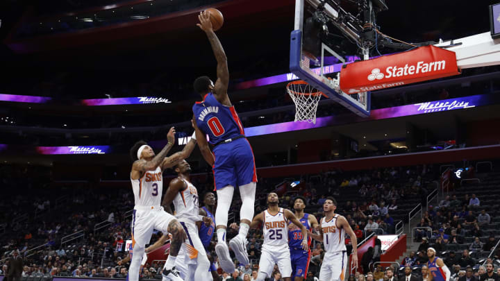 Feb 5, 2020; Detroit, Michigan, USA; Detroit Pistons center Andre Drummond (0) goes to the basket in the first half on Phoenix Suns forward Kelly Oubre Jr. (3) at Little Caesars Arena. Mandatory Credit: Rick Osentoski-USA TODAY Sports