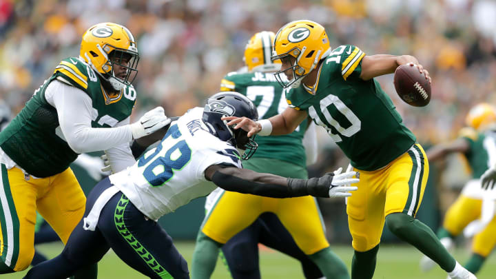 Green Bay Packers quarterback Jordan Love (10) dodges pressure from Seattle Seahawks linebacker Derick Hall (58) during their preseason football game Saturday, August 26, 2023, at Lambeau Field in Green Bay, Wis. Green Bay defeated Seattle 19-15.
Wm. Glasheen USA TODAY NETWORK-Wisconsin