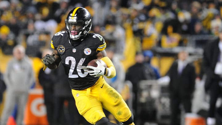Dec 10, 2017; Pittsburgh, PA, USA; Pittsburgh Steelers running back Le'Veon Bell (26) picks up a first down in the fourth quarter against the Baltimore Ravens at Heinz Field. The Steelers won 39-38.  Mandatory Credit: Philip G. Pavely-Imagn Images