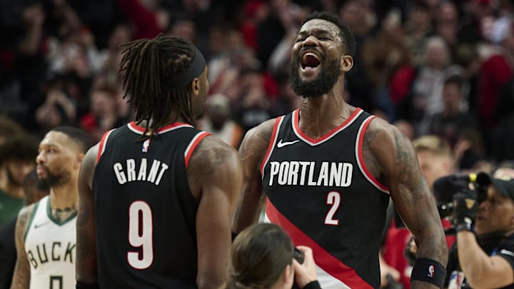 Jan 31, 2024; Portland, Oregon, USA; Portland Trail Blazers center Deandre Ayton (2) celebrates with forward Jerami Grant (9) after beating the Milwaukee Bucks at Moda Center. Mandatory Credit: Troy Wayrynen-Imagn Images