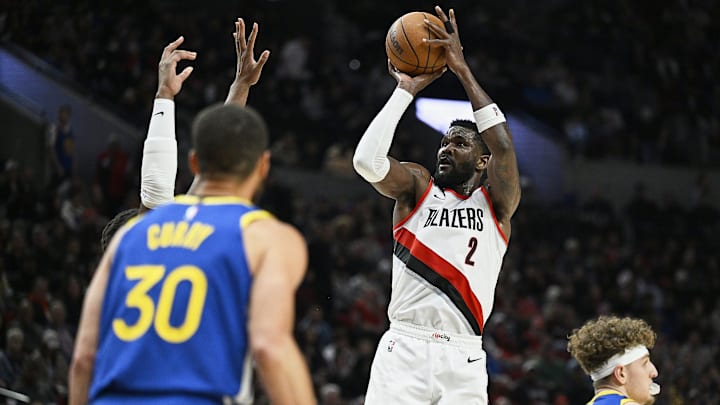 Apr 11, 2024; Portland, Oregon, USA; Portland Trail Blazers center Deandre Ayton (2) shoots a jump shot during the second half against the Golden State Warriors at Moda Center. Mandatory Credit: Troy Wayrynen-Imagn Images