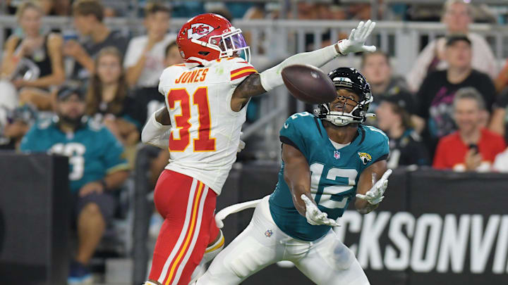 Jacksonville Jaguars wide receiver Devin Duvernay (12) pulls in a touchdown pass from Jacksonville Jaguars quarterback C.J. Beathard (3) late in the second quarter while being defended by Kansas City Chiefs cornerback Nic Jones (31). The Jaguars led 20 to 10 at the end of the first half. The Jacksonville Jaguars hosted the Kansas City Chiefs in the Jaguars first preseason game of the season Saturday, August10, 2024 at EverBank Stadium in Jacksonville, Fla.