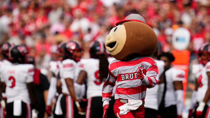 Sep 16, 2023; Columbus, Ohio, USA; Brutus Buckeye races an Ohio State student across the field during the first half of the NCAA football game against the Western Kentucky Hilltoppers at Ohio Stadium.